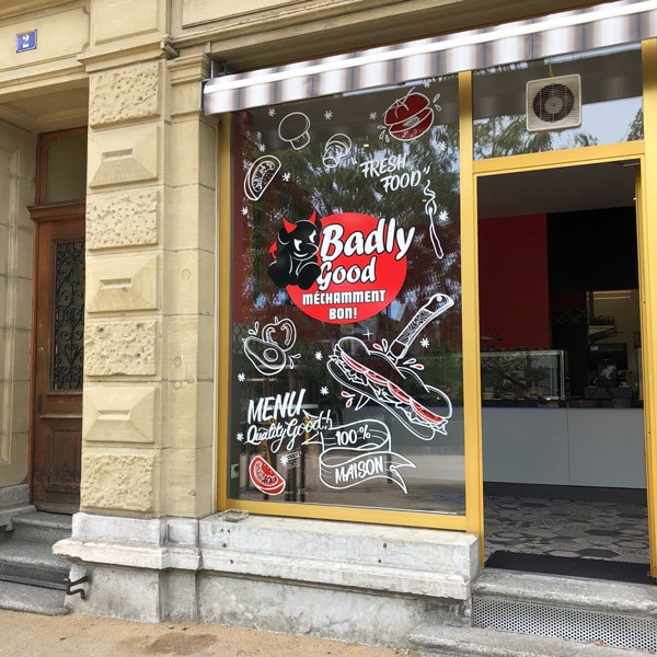 Peinture en lettre sur vitrine et lettering restaurant Fribourg